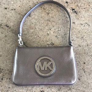 Metallic pebbled leather wristlet; silver hardware; EUC; two interior pockets.